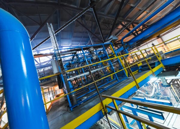 Fiberglass production industry equipment at manufacture background