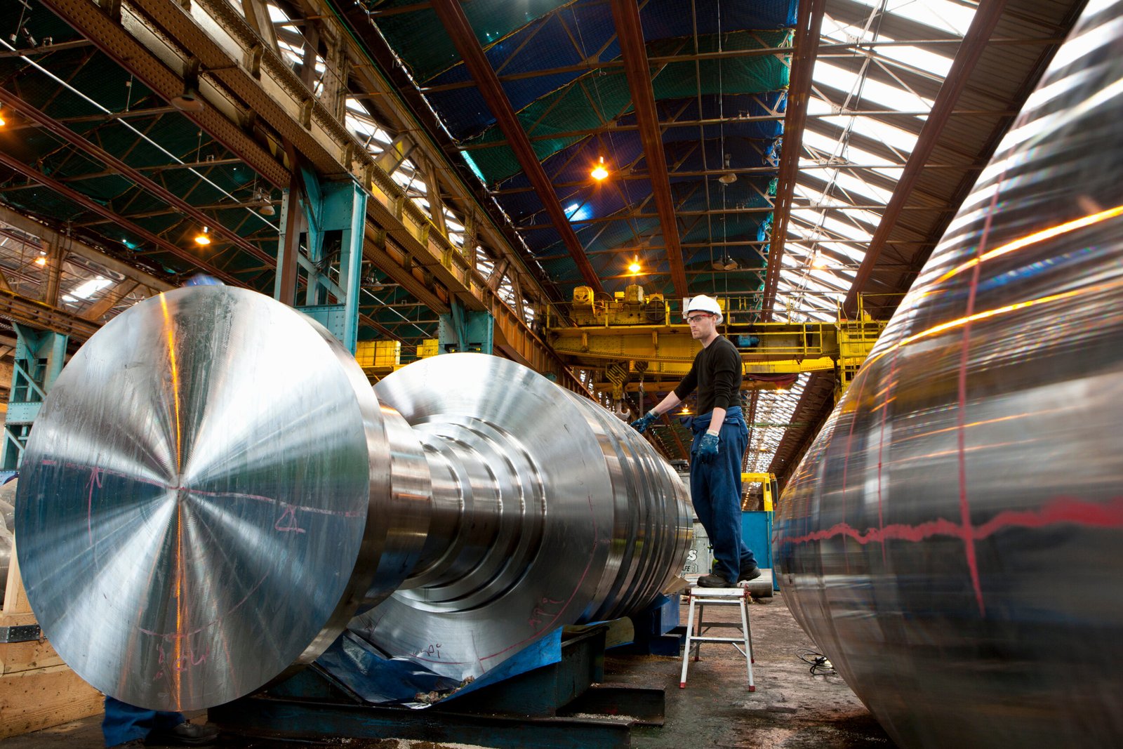 steel-worker-inspects-metal-parts-in-factory-2026-01-11-08-37-40-utc